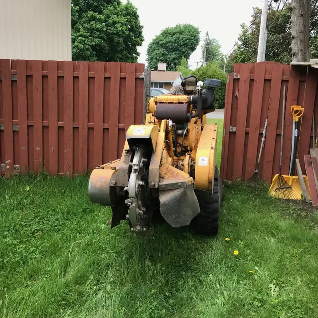 Finished stump grinding area with fresh mulch
